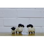 A group of three black faced pottery sheep (3)