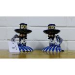 A pair of Ginori dolphin blue and white candlesticks, 12cm high