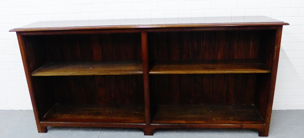A mahogany open bookcase, the rectangular top over a planked back with adjustable shelves on bracket