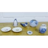 Royal Copenhagen porcelains to include a penguin, a bird, two small vases, a pair of floral