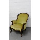 A Victorian walnut framed armchair with upholstered back, arms and seat on cabriole supports, 90 x