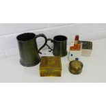 A mixed lot to include two pewter tankards, two brass boxes, A Royal Delft Amsterdam house and a