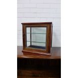 A mahogany and satin inlaid glazed panel display cabinet with gadrooned beading and a glazed shelved