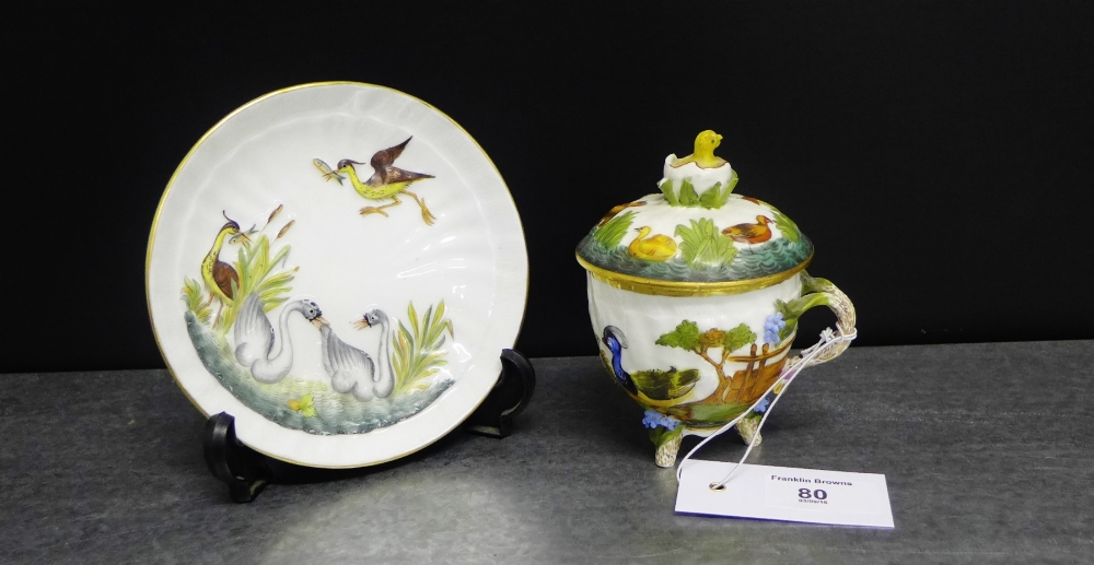 A Capodimonte porcelain custard cup and saucer, the lid with a hatched egg and duck, all further