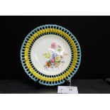 A Mintons cabinet plate with reticulated blue and gilded rim with painted floral sprays to centre,