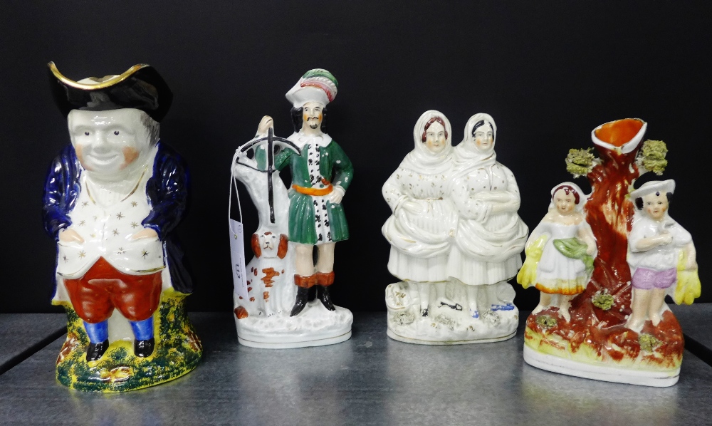 A quantity of Staffordshire wares to include three flat backs and a Toby jug on sponge ware base,