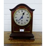 A Hamilton & Inches mahogany case mantle clock, the domed top above a silvered dial with black Roman