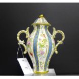 87A Serves porcelain baluster vase and cover with scrolling twin handles to side with painted floral