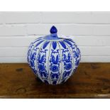 A blue and white lobed jar and cover