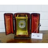 A late 19th century French gilt brass carriage clock, the silvered dial with Arabic numerals and