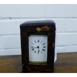 A late 19th century French brass case carriage clock, the white enamel dial with black Roman