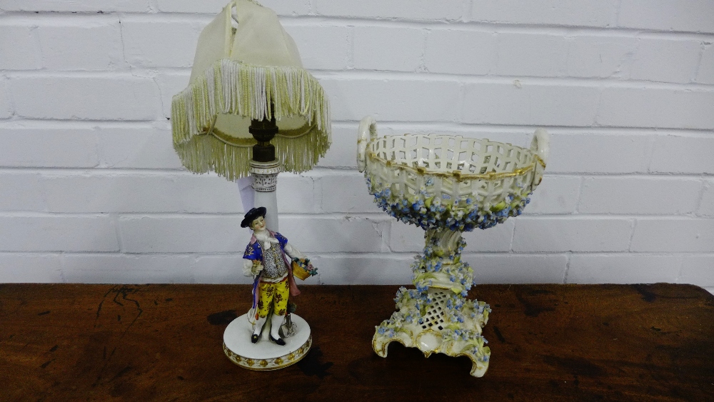 A continental porcelain figural table lamp base, together with a floral encrusted continental