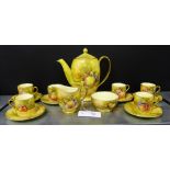 A Royal Winton fruit painted coffee set, signed ZKAS, comprising a coffee pot, six coffee cans,