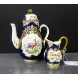 A Royal China Works Worcester fancy bird patterned cream jug, together with a similar unmarked
