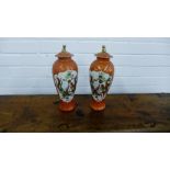 A pair of orange glazed baluster vases and covers, 32cm high, (2)