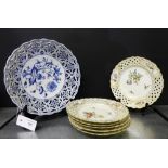 A set of six Helena Wolfson white glazed porcelain plates with reticulated and gilded rims, with