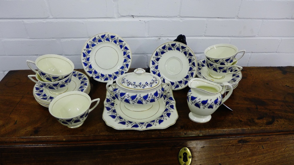 A Royal Doulton Coventry pattern tea set, comprising five cups, six saucers, six side plates, a cake