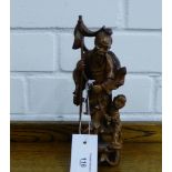 A carved fruit wood figure of a Fisherman, 21cm high