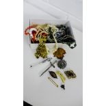 A mixed lot to include two Scottish silver brooches and other costume brooches and a quantity of