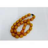 A strand of butterscotch amber coloured beads