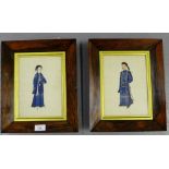 A companion pair of Chinese paintings on paper, depicting figures in blue silk robes, contained