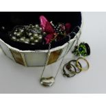 A jewellery box containing a 9 carat gold dress ring, a silver pendant stamped Tiffany and a