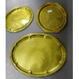 An Eastern brass octagonal plate together with two oval brass trays with gadrooned rims (3)