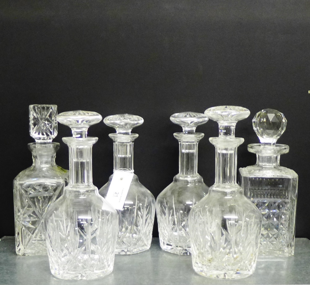 A collection of six cut crystal spirit and wine decanters and stoppers, (6)