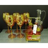 Cranberry glass to include a condiment set on a plated stand, together with a claret jug and set