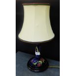 Moorcroft table lamp and shade, the cobalt blue ground tubeline decorated with flowers, on a