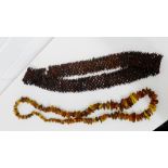 An amber bead necklace and a brown faux bean belt (2)