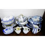 A quantity of Staffordshire blue and white pottery to include tureens, serving dishes, jugs, etc.,