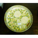 A Japanese Satsuma charger decorated with chrysanthemums and foliage within a stylised border and