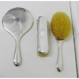 Birmingham silver backed dressing table set comprising hand mirror, hair brush and clothes brush, (