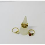 A collection of 9ct gold dress rings to include pearl and coral set examples, (3)