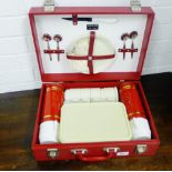 A Sirram red vinyl picnic hamper complete with thermos flask and picnic set