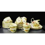 A Hammersley & Co rose patterned teaset, comprising twelve side plates, twelve saucers, twelve tea