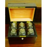 A George III mahogany decanter box, the rectangular top with a brass handle lifting to reveal a