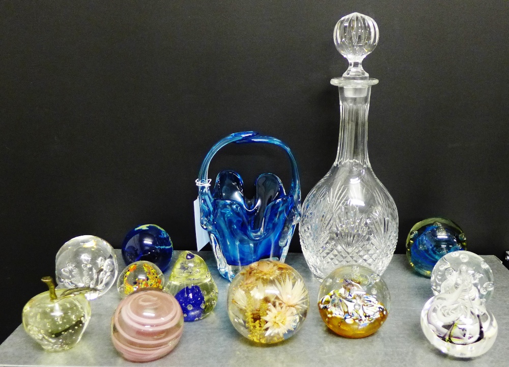 A collection of paperweights to include Caithness and Mdina, together with a decanter and stopper