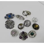 A collection of silver and white metal brooches (12)