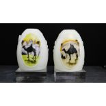 A pair of Hail Glass lamp shades, painted with a camel and dessert scene, 15cm high, (2)