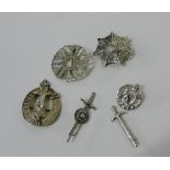 A collection of seven silver and white metal brooches to include a dagger, a Viking longboat and two