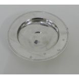 A contemporary silver Alms dish of typical form, with makers marks for Asprey, London 1991, 15cm