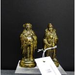 A pair of bronze immortal figures, each on circular base, 9cm high, (2)