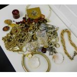 A quantity of vintage and later costume jewellery to include necklaces, brooches and faux pearls