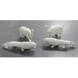 A collection of early 20th century carved ivory figures to include two elephants and two lions (4)