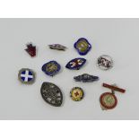 A collection of silver and enamel Nurses badges to include two Pelican examples together with