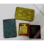 A mixed lot to include a musical lighter, a 1914 Christmas tin and a faux Shagreen cigarette