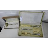 A cased cake serving set, comprising knife, fork and slice, together with a cased miniature sauce