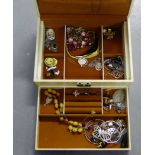 A vintage vinyl jewellery box containing a selection of costume jewellery to include beads,